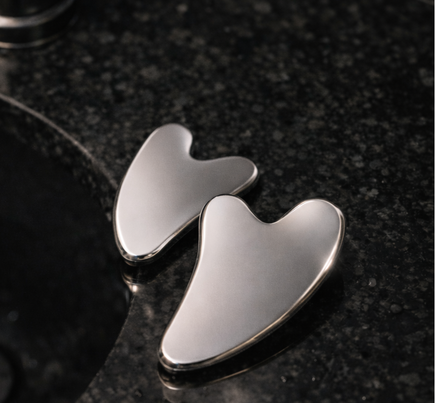 facial massage tool close up stainless steel detail